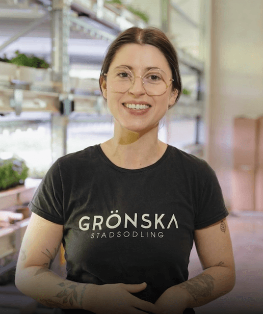 Natalie, co-founder, next to a vertical farm.