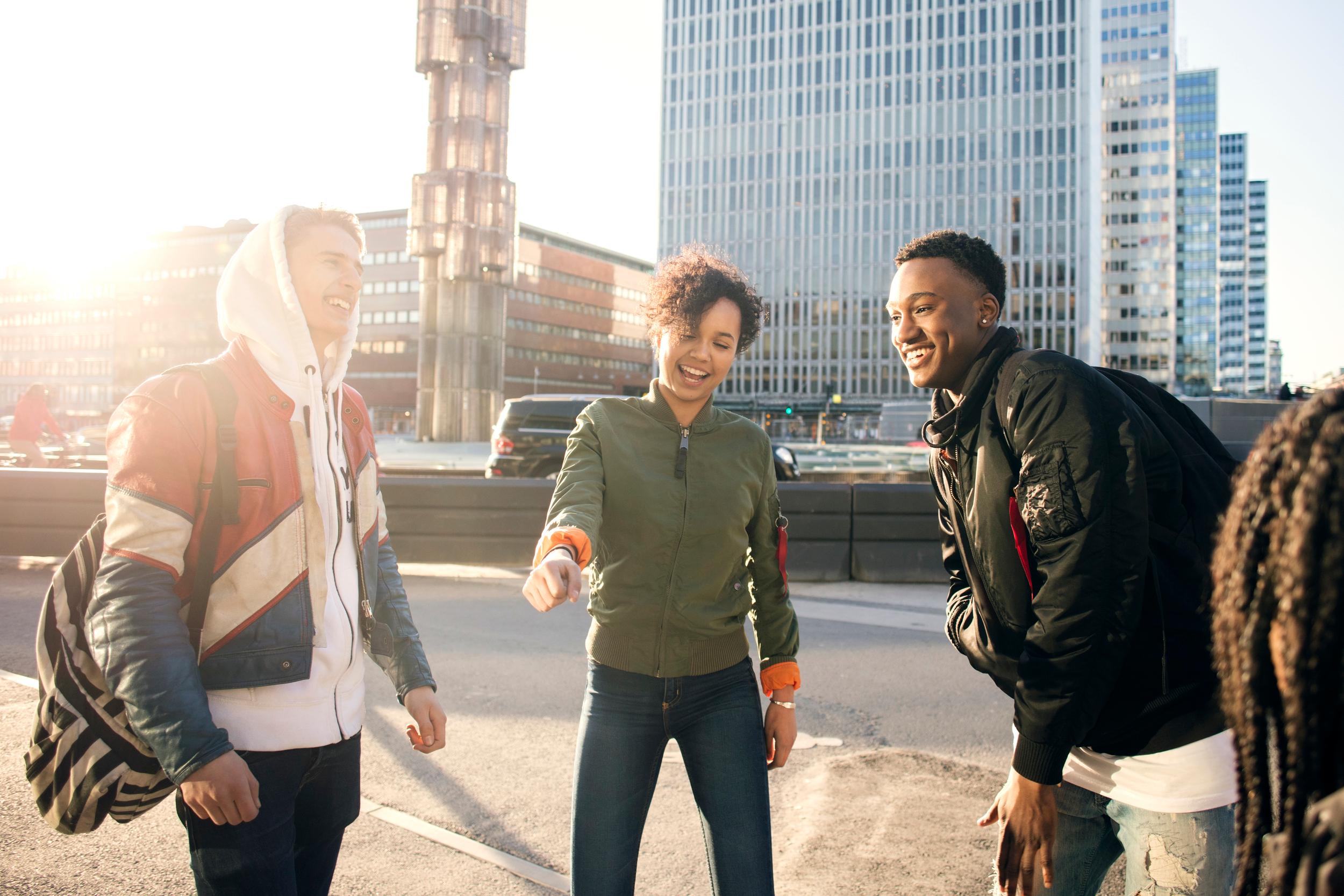 Three young adults hanging out in central Stockholm.