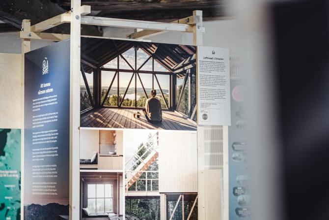 Woodlife exhibition posters showing different projects with wood architecture.