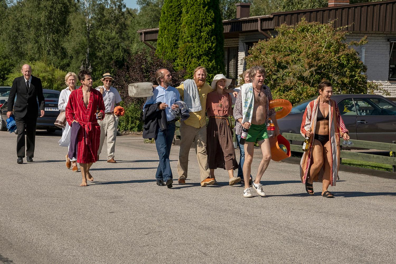 The former commune members heading to the beach.