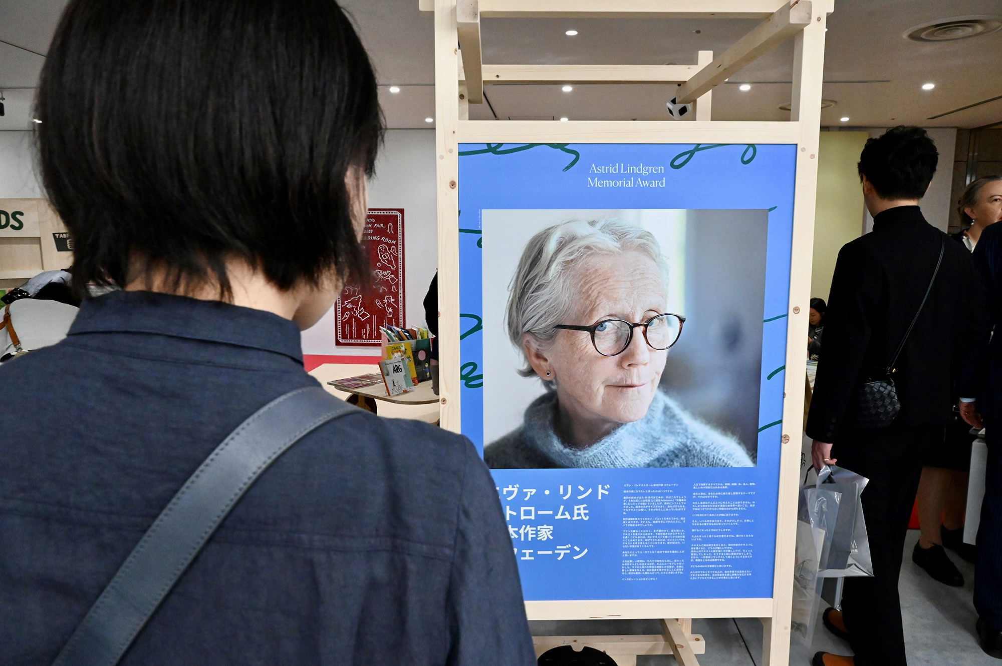 A person in Tokyo looking at the poster exhibition,