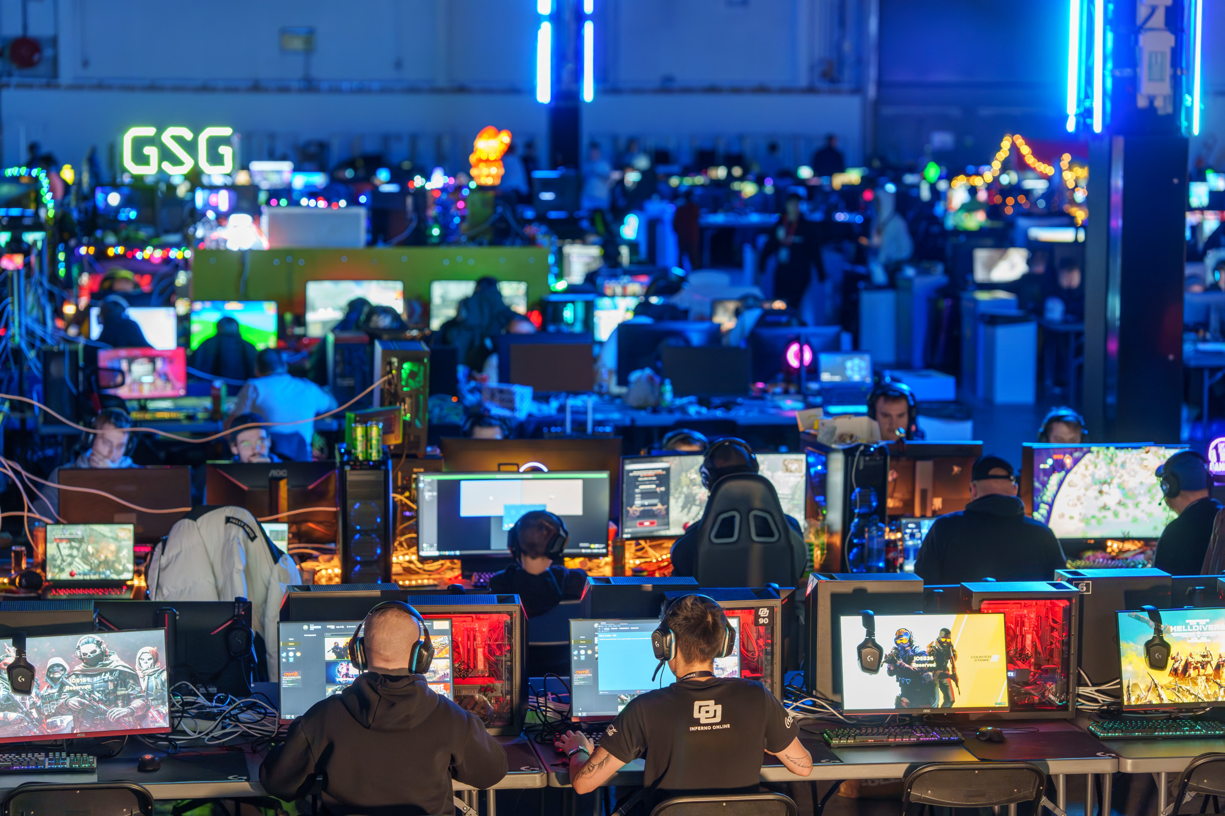 Rows upon rows of people sitting in front of computer screens.